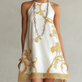 Hersilia | Vestido mini de encaje blanco con motivos dorados