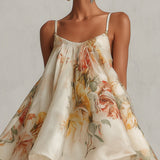 Brianda | Vestido mini de organza con volantes de flores beis y borde de encaje