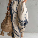 Mono con escote halter y estampado en tinta