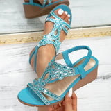 Lía – Sandalias de cuña con detalles brillantes
