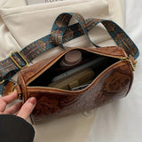 Ludgarda | Bolso cilíndrico con relieve barroco