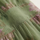 Ariana – Vestido largo floral con cuello halter y caída elegante