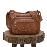 Minerva | Bolso bandolera con broche de corazón