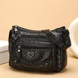 Minerva | Bolso bandolera con broche de corazón