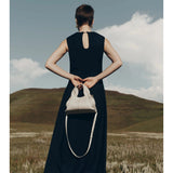 Vega – Bolso de mano minimalista