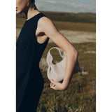 Vega – Bolso de mano minimalista