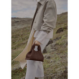 Vega – Bolso de mano minimalista