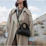 Vega – Bolso de mano minimalista