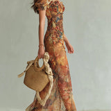 Vestido maxi de chiffón naranja con estampado al óleo