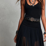 Conjunto de top negro y falda maxi de tul