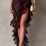 Vestido chic negro y rojo con flores y volantes