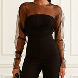 Sira | Mono elegante con detalle de rejilla, negro
